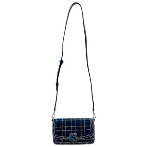 Kate Spade New York Dakota Denim Check convertible crossbody bag in indigo with shoulder strap and checkered pattern.