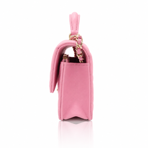 Chanel Mini Top Handle Rectangular Flap Bag in pink lambskin right side view, featuring a gold chain strap and a top handle, set against a clean white background with a subtle reflection.