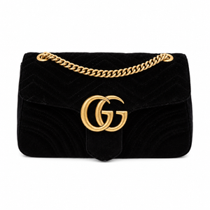 Gucci GG Marmont Medium Black Velvet Matelasse Shoulder Bag Chain Strap with a gold-tone chain strap and a prominent interlocking GG logo on the front, representing the Gucci brand.