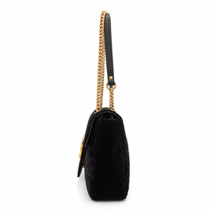 Gucci GG Marmont Medium Black Velvet Matelasse Shoulder Bag Chain Strap with a gold-tone chain strap and a black leather strap, shown from a side profile view on a white background.