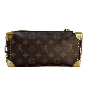 A Louis Vuitton monogram canvas zip-around wallet or clutch with gold-tone hardware, shown from a top-down view on a light gray surface.