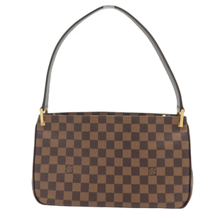 A brown and dark brown checkerboard handbag with a dark brown shoulder strap and gold-tone hardware, shown against a plain white background.