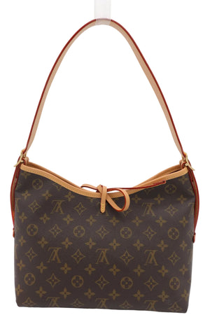 Louis Vuitton monogram canvas shoulder bag with tan leather trim and strap, shown against a plain light background.
