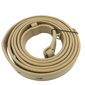 A coiled tan leather shoulder strap with gold-tone metal hardware, photographed on a clean white background.