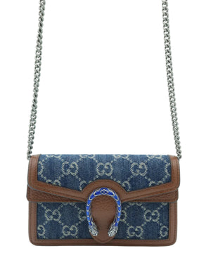 A Gucci shoulder bag in blue GG Supreme canvas with brown leather trim and a silver-tone chain strap, featuring a horsebit-shaped turn-lock closure embellished with blue enamel and silver crystals.