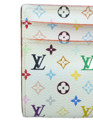 Close-up of a Louis Vuitton monogram wallet or card holder in off-white coated canvas with multicolored monogram motifs and black LV logos.