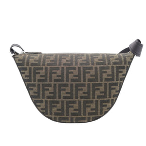 A Fendi monogram canvas half-moon shoulder bag in brown and beige, featuring the signature FF logo pattern and dark brown leather trim, shown against a plain white background.
