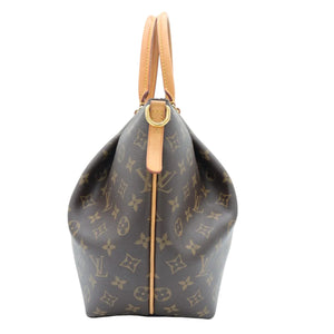 A Louis Vuitton monogram canvas shoulder bag with tan leather handles and trim, shown from the back on a white background.