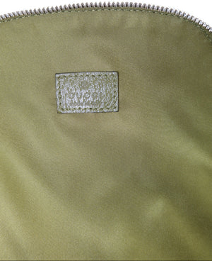 Close-up of a metallic olive green nylon bag with a silver zipper and a textured silver brand patch on a white background.