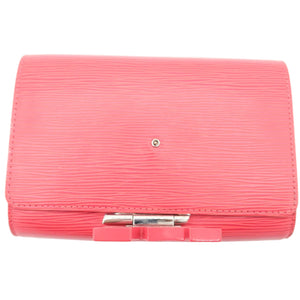 A pink textured leather clutch bag with a silver-tone metal clasp, shown against a plain white background.
