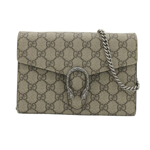 A Gucci shoulder bag in beige and brown GG Supreme canvas with a silver-tone horsebit clasp and chain strap, photographed on a light gray background.