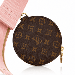 Close-up of Louis Vuitton Multi Pochette Accessoires round coin purse in brown Monogram canvas attached to the pink jacquard strap