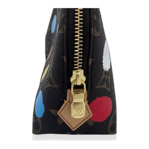 Louis Vuitton x Yayoi Kusama Cosmetic Pouch vachetta zipper pull detail on white studio background