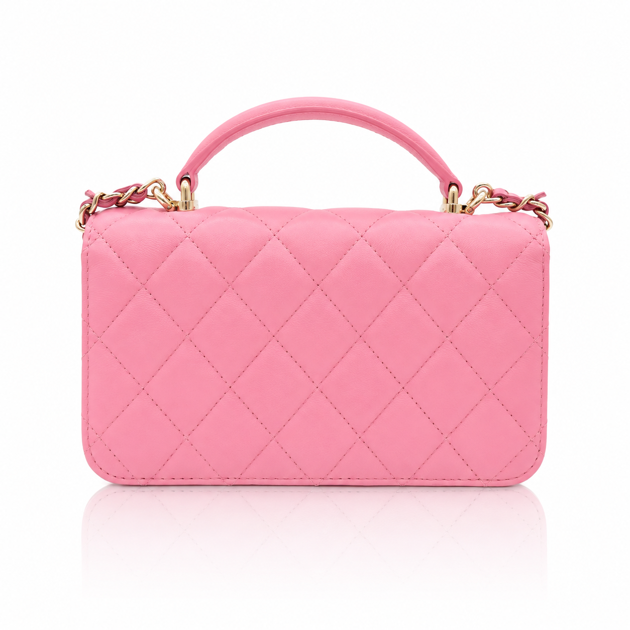 Chanel Mini Top Handle Rectangular Flap Bag in pink quilted lambskin back view  gold-tone chain accents, shown on a clean white background with a soft reflection below.