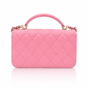 Chanel Mini Top Handle Rectangular Flap Bag in pink quilted lambskin back view  gold-tone chain accents, shown on a clean white background with a soft reflection below.