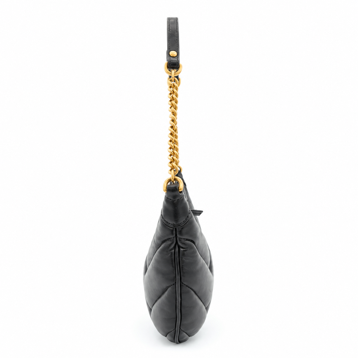 A black quilted leather shoulder bag with a gold-tone chain link strap and a black leather top handle, shown from a side profile view on a white background.