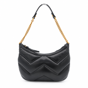 A black quilted leather shoulder bag with a distinctive chevron pattern, featuring a gold-tone chain strap and a black leather top handle, set against a plain white background.