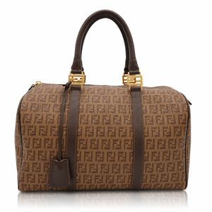 Fendi Zucchino Spalmati Forever Bauletto Boston Bag canvas duffel bag with dark brown leather handles and trim, gold-tone hardware, and an allover FF logo pattern on a white background.
