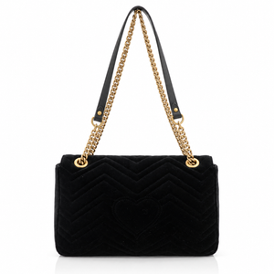 Gucci GG Marmont Medium Black Velvet Matelasse Shoulder Bag Chain Strap  with a chevron pattern, a central heart motif, a black leather shoulder strap, and a gold-tone chain link strap, shown on a plain white background.