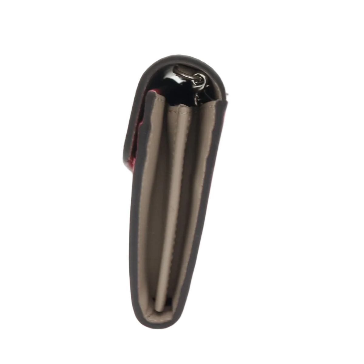 A sleek, metallic dark gray or black pen-shaped device standing upright on a clear acrylic block against a white background.