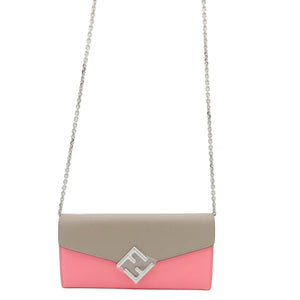 A color-blocked envelope shoulder bag with a taupe top half, pink bottom half, and a silver-tone interlocking FF logo clasp on a white background.