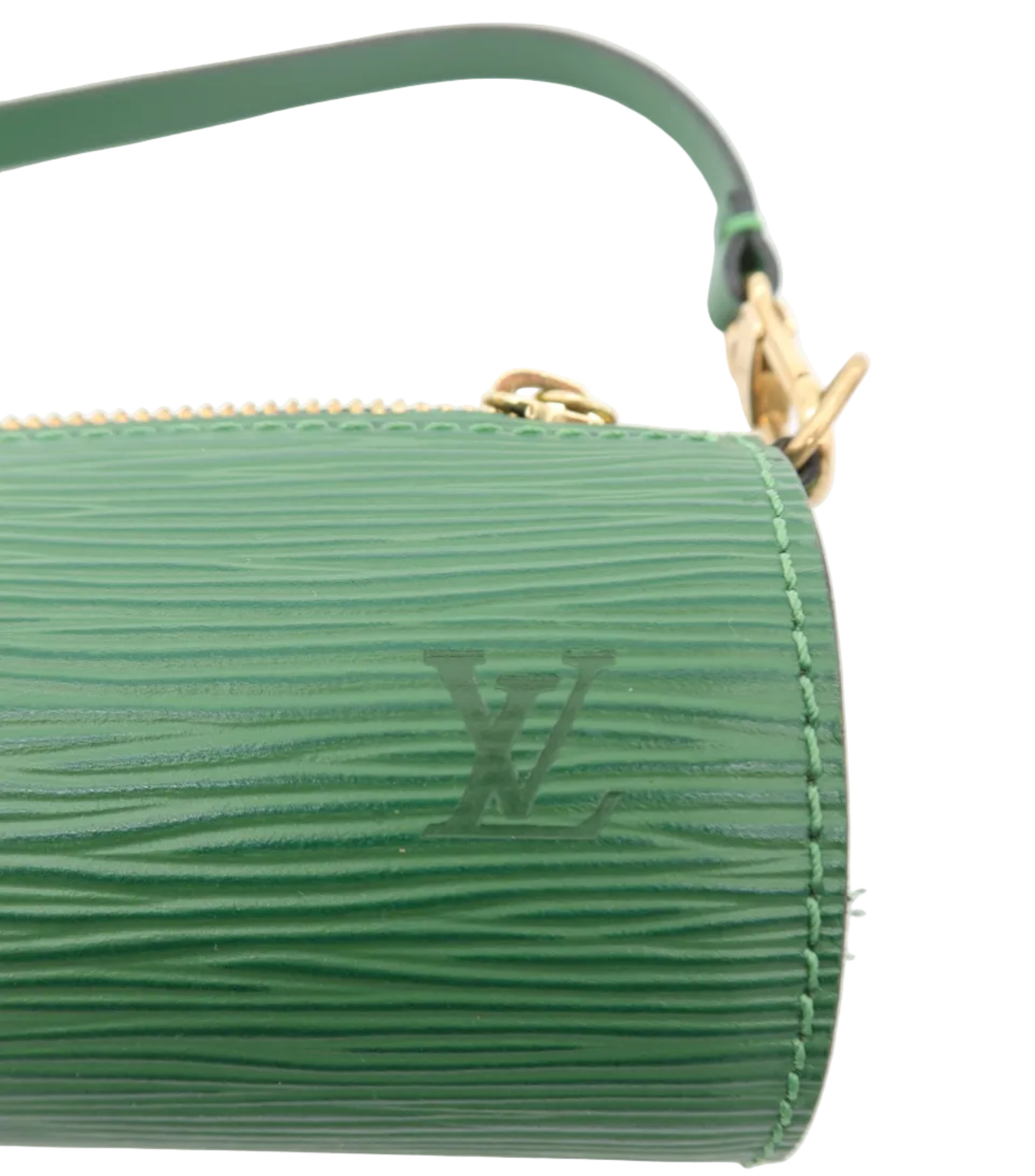 A close-up of a green textured leather pouch or clutch with a gold zipper and a matching green strap, featuring an embossed LV logo on a white background.