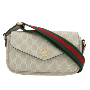Gucci shoulder bag in beige GG Supreme canvas with a green and red web stripe and a gold-tone interlocking G logo on the front flap.