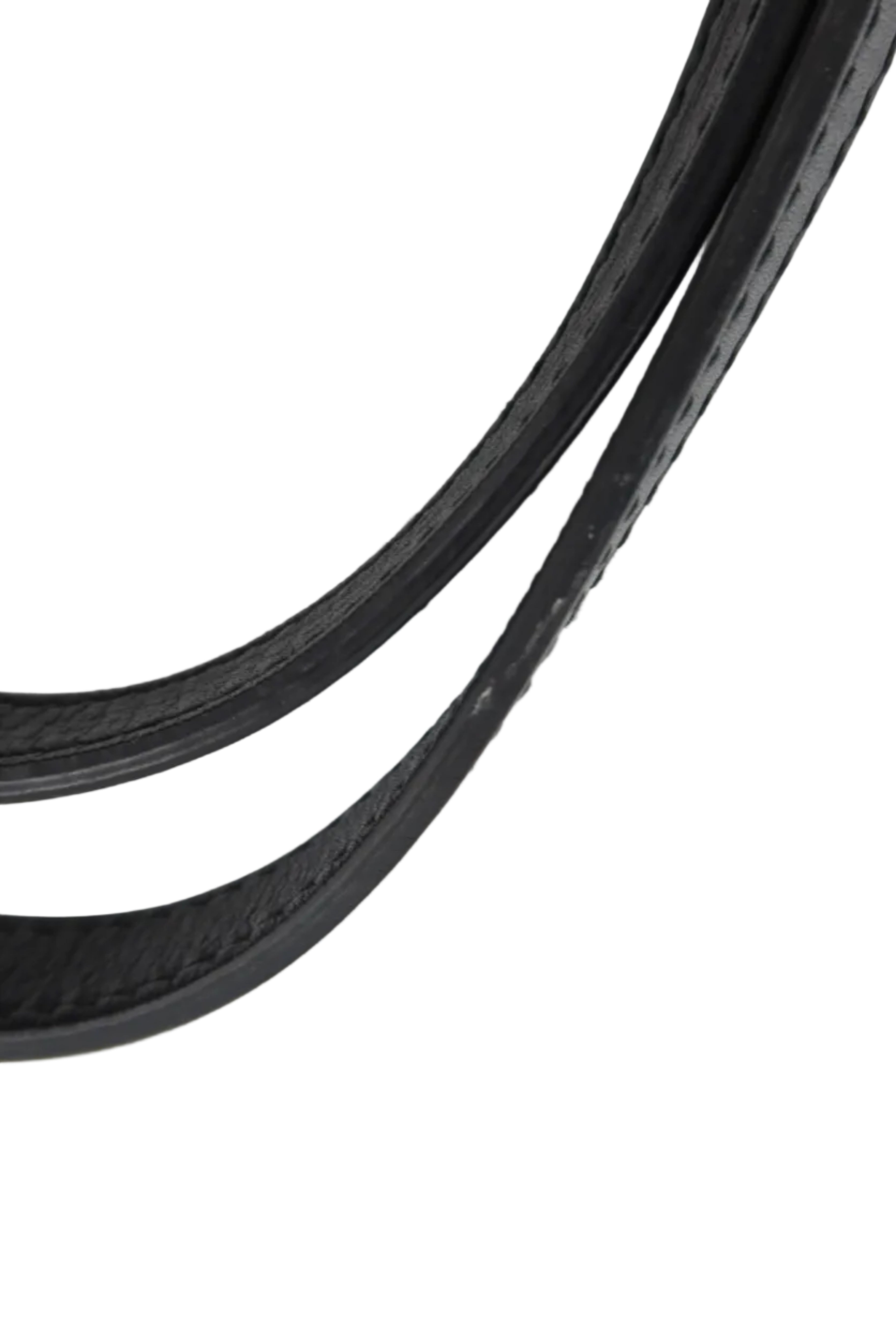 A close-up of a black leather strap, likely a handbag strap, showing the stitched edge against a plain white background.