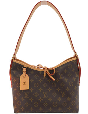 Louis Vuitton monogram canvas shoulder bag with tan leather trim, a top handle, and a hanging Louis Vuitton tag, photographed against a plain white background.
