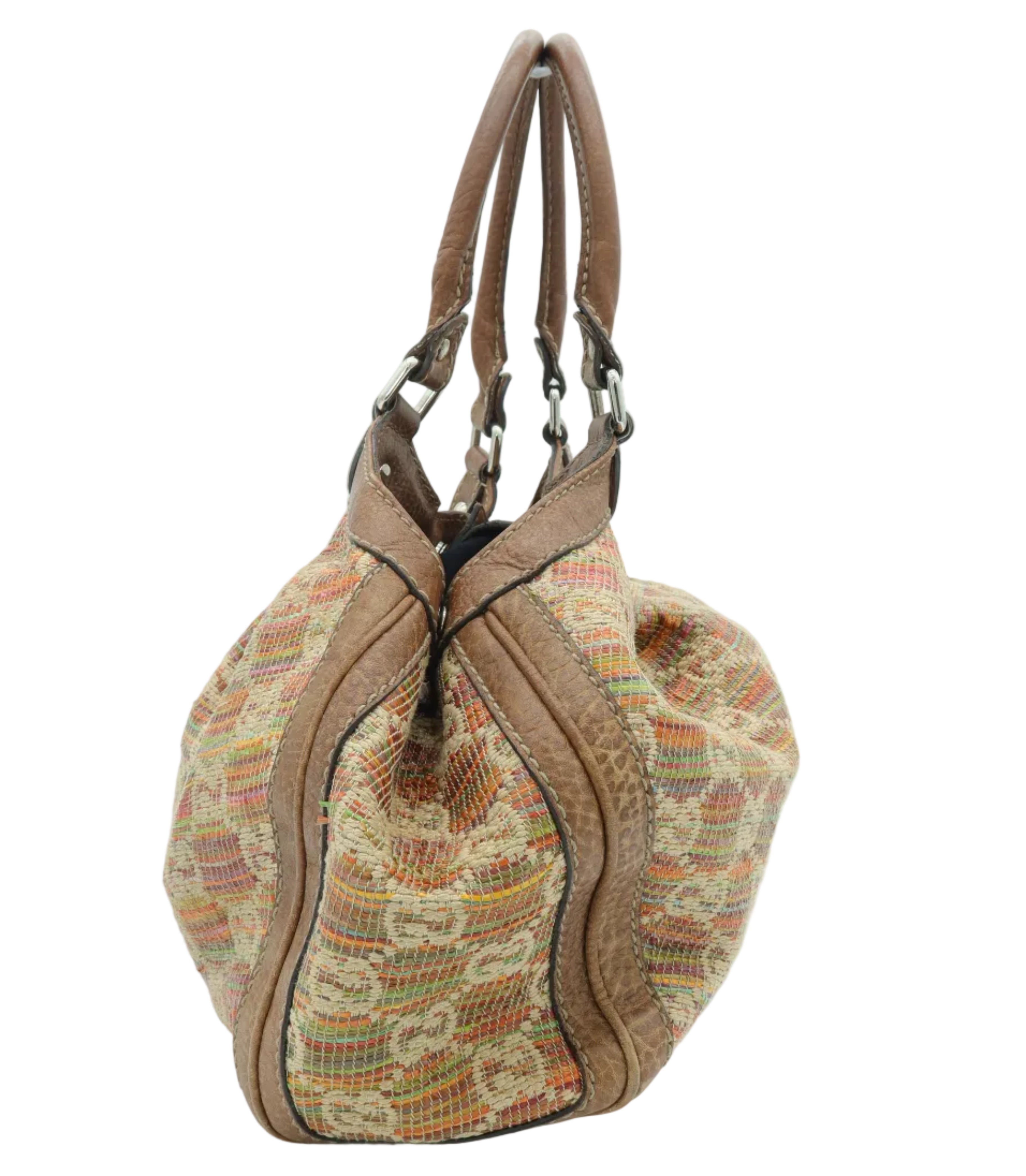A vintage Gucci slouchy bucket bag made of brown leather and a beige and orange patterned brocade fabric, shown on a white background.