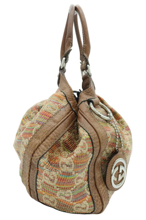 A Gucci shoulder bag featuring a brown leather trim and handle, combined with a multicolor woven canvas body. The iconic interlocking GG logo is visible on the side leather patch.