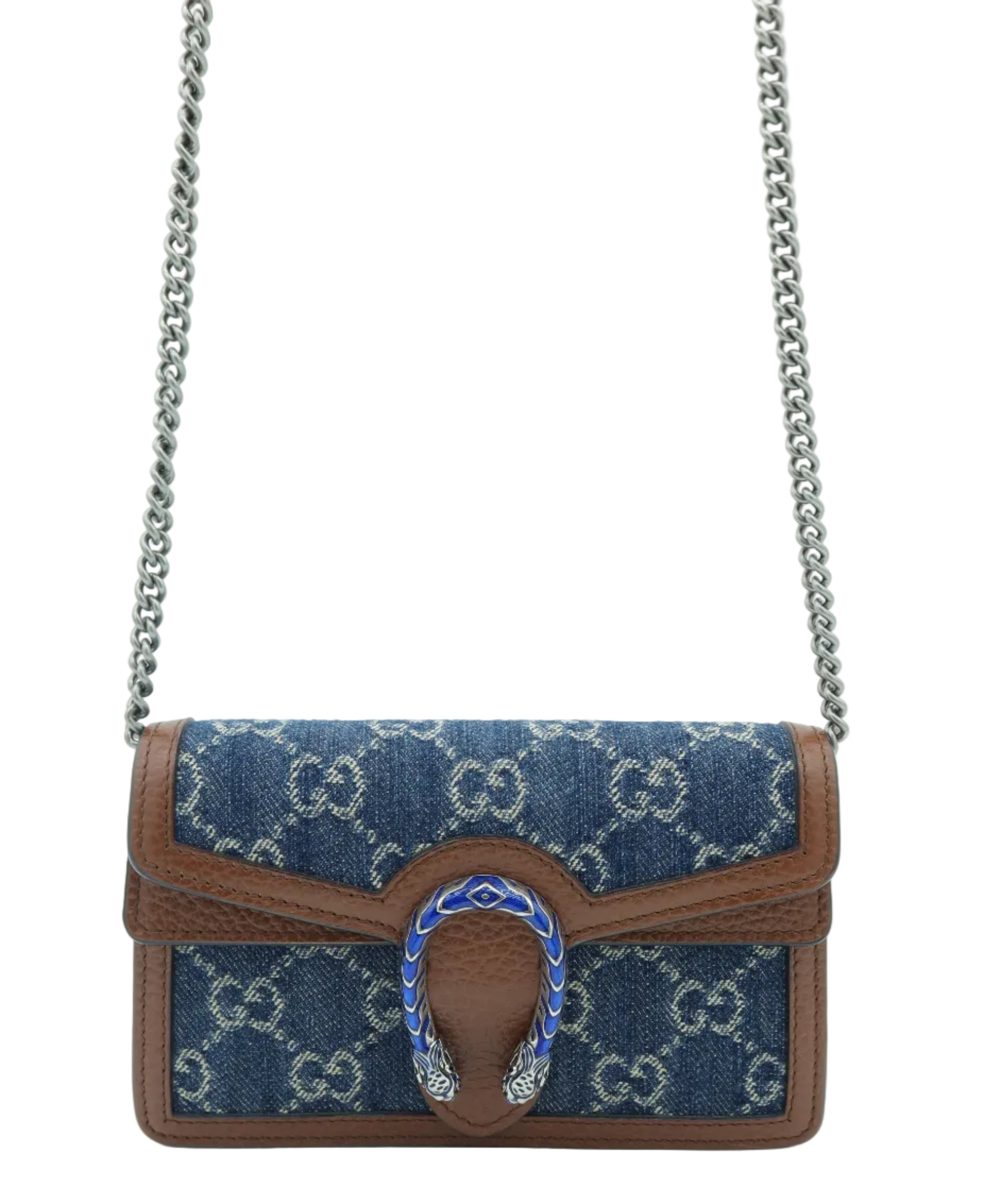 A Gucci shoulder bag in blue GG Supreme canvas with brown leather trim and a silver-tone chain strap, featuring a horsebit-shaped turn-lock closure embellished with blue enamel and silver crystals.