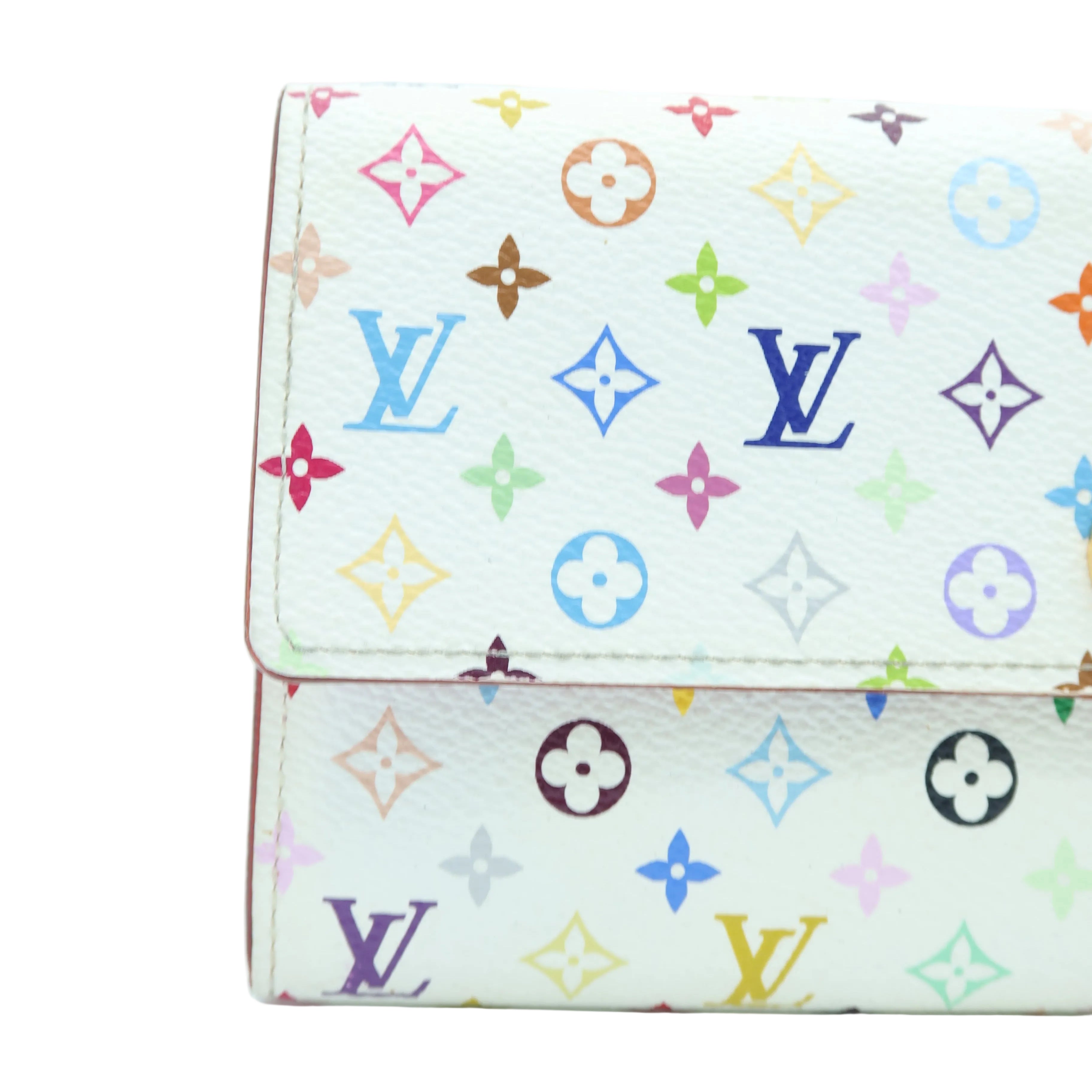 A Louis Vuitton wallet in white monogram canvas with a colorful, multicolor print of the brand's classic monogram motifs, shown on a plain white background.