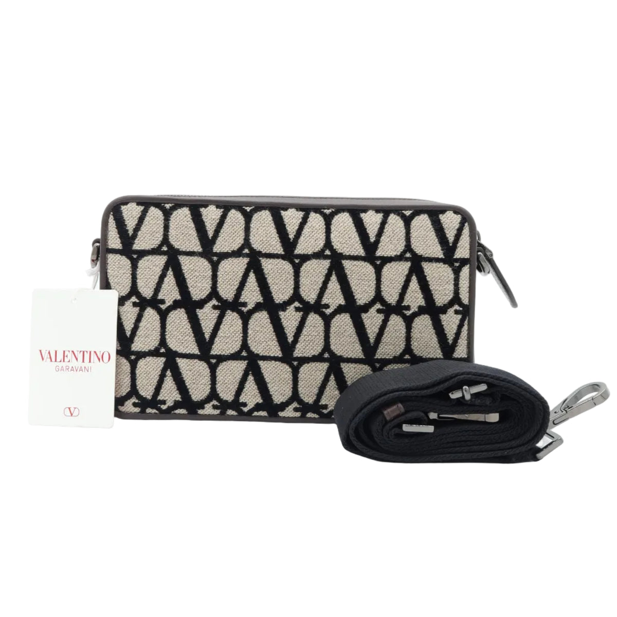 A Valentino monogram shoulder bag in beige and black, shown with its black detachable strap and a branded paper tag on a white background.