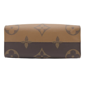 A Louis Vuitton monogram wallet in brown and tan coated canvas, shown against a plain white background.