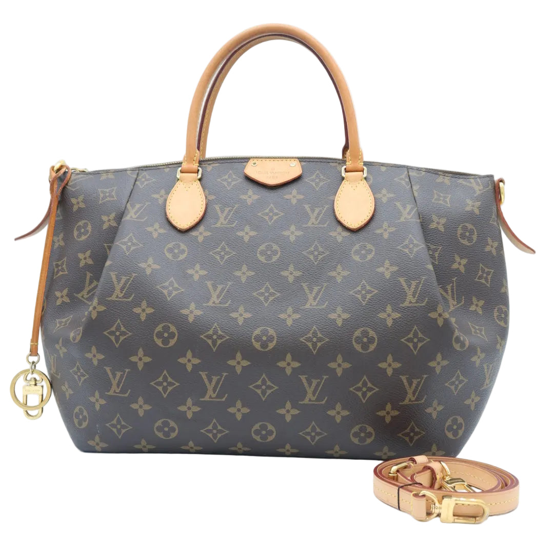 A Louis Vuitton monogram canvas Speedy handbag in dark brown with tan leather handles and a matching detached shoulder strap, displayed on a clean white background.