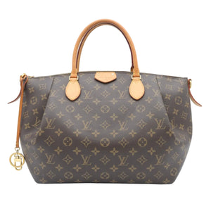 A Louis Vuitton monogram canvas handbag with tan leather handles and trim, shown against a plain white background.