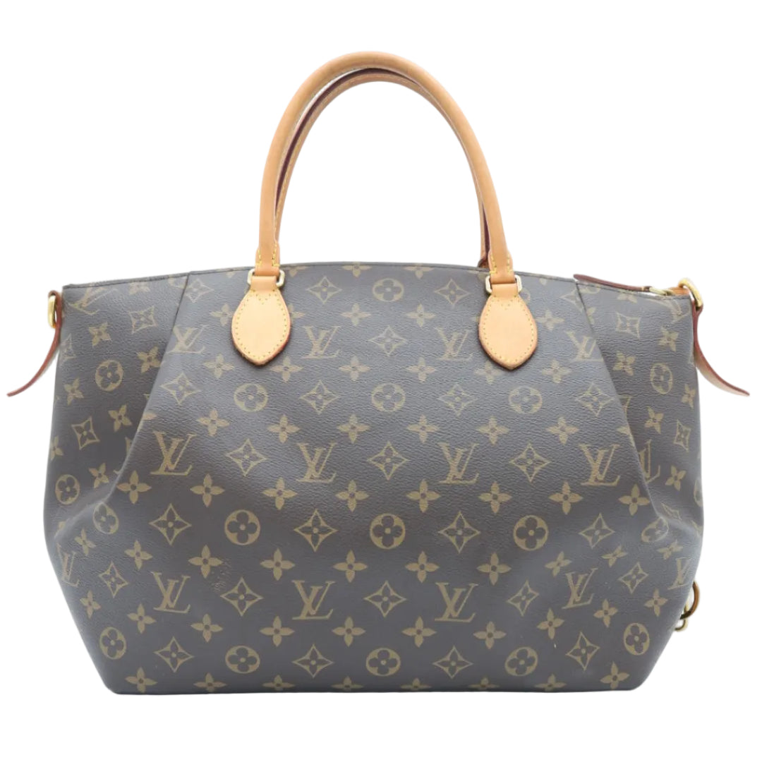 A Louis Vuitton monogram canvas handbag with tan leather handles and gold-tone hardware, photographed against a plain white background.