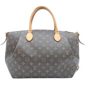 A Louis Vuitton monogram canvas handbag with tan leather handles and gold-tone hardware, photographed against a plain white background.