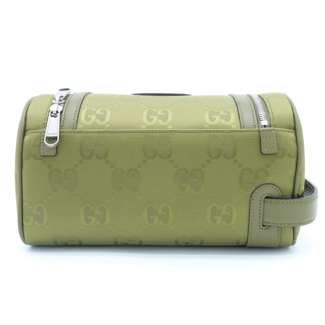 A green monogram canvas cylindrical pouch or mini bag with silver zipper pulls and a matching green leather strap, shown against a plain white background.