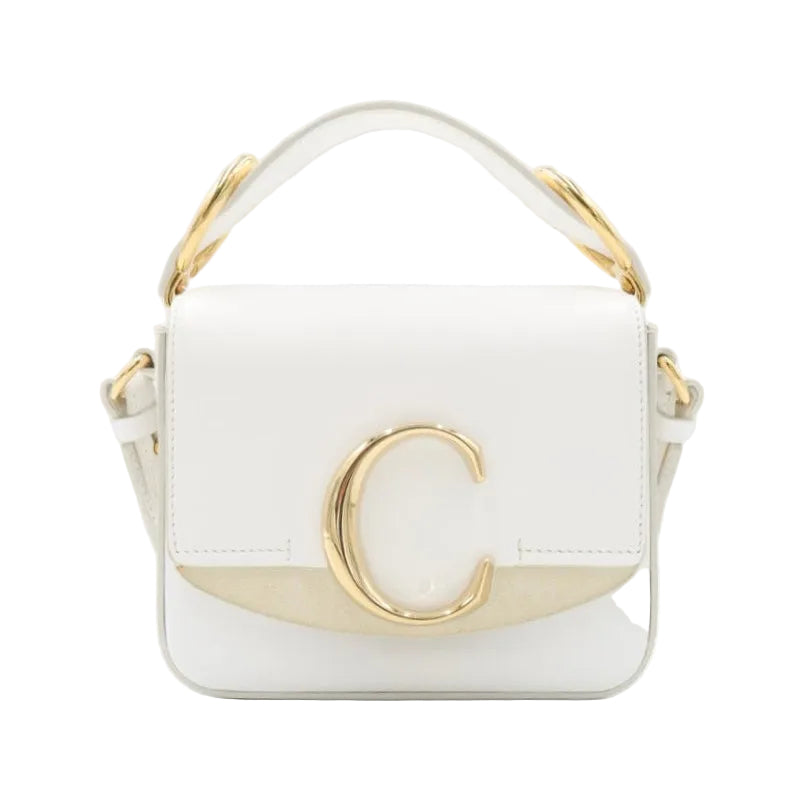 A structured white leather handbag with a gold-tone C logo on the front flap, a matching top handle, and a gold-tone side detail, shown against a plain white background.