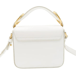 A white faux leather top-handle crossbody bag with gold-tone hardware and a matching white shoulder strap, shown against a plain white background.