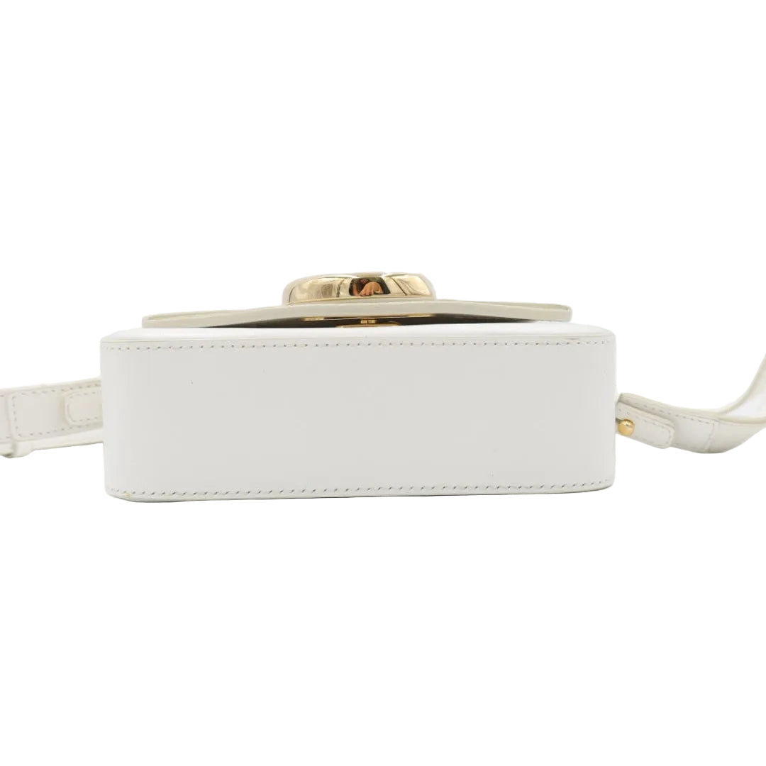 A white leather crossbody bag with a gold-tone buckle closure and a matching white strap, shown from a front-facing angle on a white background.