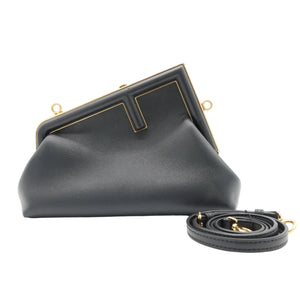 A black leather clutch bag with gold-tone metal frame details and a matching detachable shoulder strap, displayed on a clean white background.