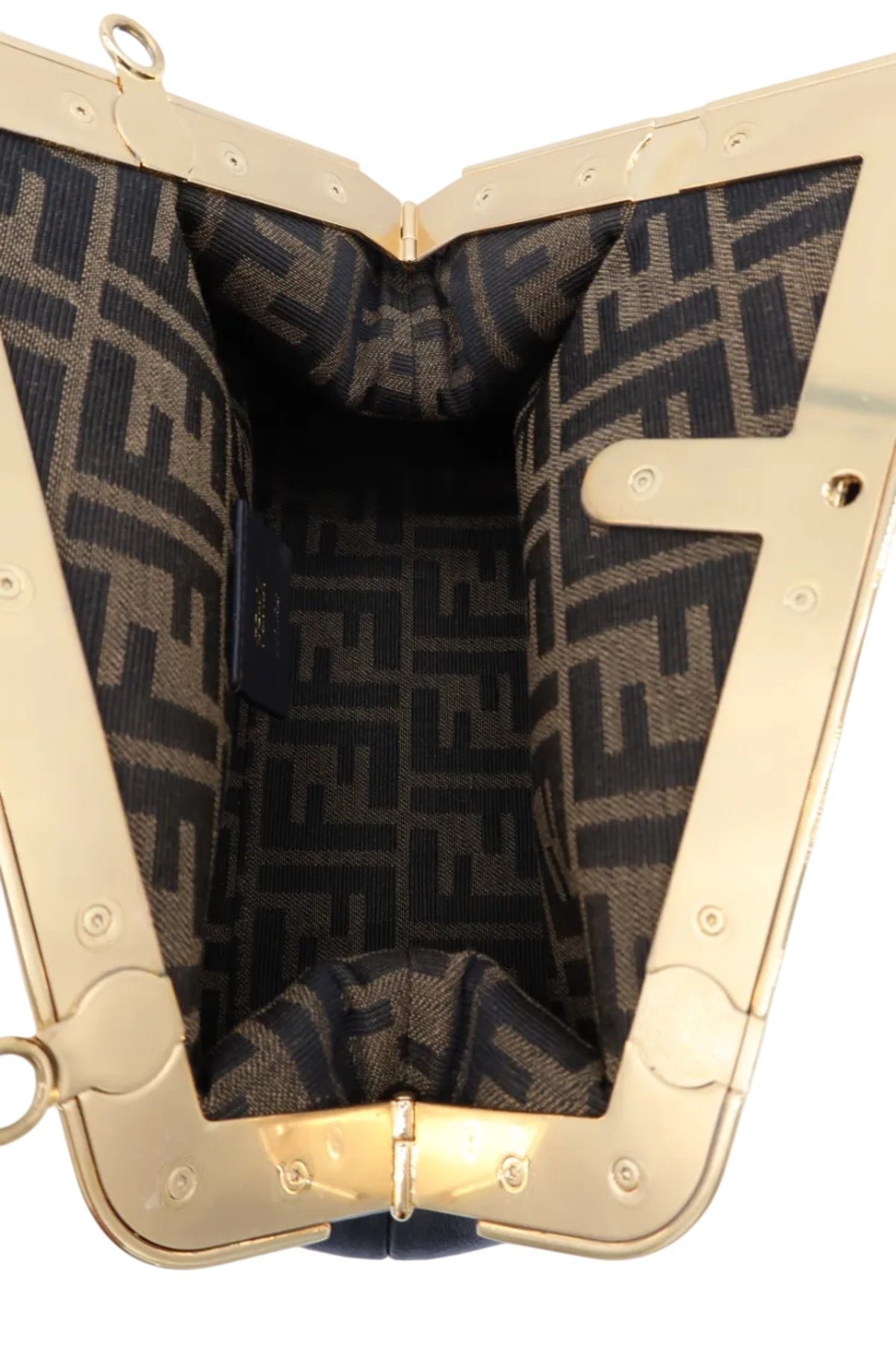 Close-up of the interior of a Fendi handbag, showing the signature brown and black FF monogram canvas lining and a polished gold-tone metal frame.