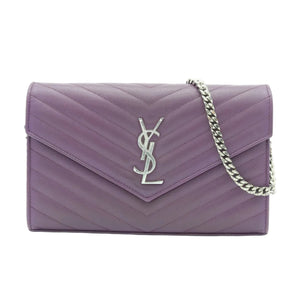 A purple quilted envelope shoulder bag with a silver-tone YSL monogram logo and a silver chain strap, shown against a plain white background.