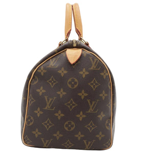 Louis Vuitton monogram canvas Speedy bag with tan leather handles and trim, photographed against a plain white background.