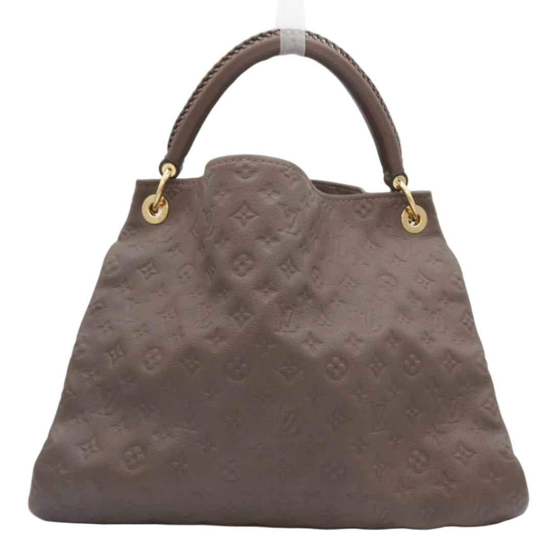 A Louis Vuitton monogram embossed leather handbag in taupe brown, featuring a structured shape, top handles, and gold-tone hardware on a white background.