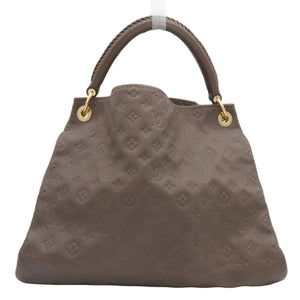 A Louis Vuitton monogram embossed leather handbag in taupe brown, featuring a structured shape, top handles, and gold-tone hardware on a white background.