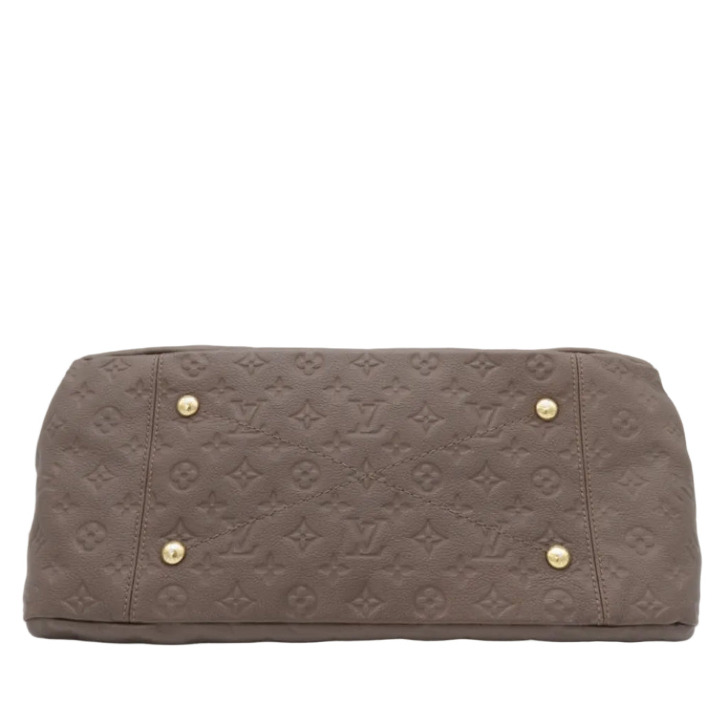A Louis Vuitton monogram canvas shoulder bag in taupe brown, featuring gold-tone metal studs on the front, photographed against a light gray background.